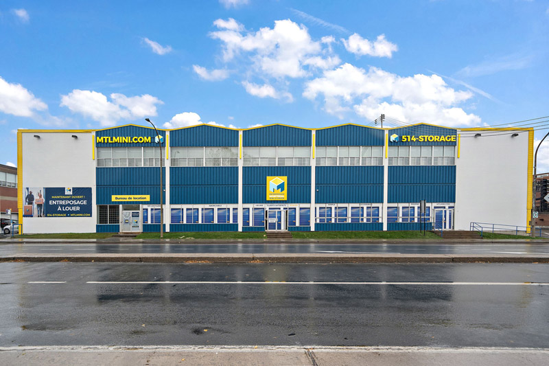 Montreal Mini-Storage Ahuntsic Cartierville self-storage facility Exterior building facade with big logo and promotional banner